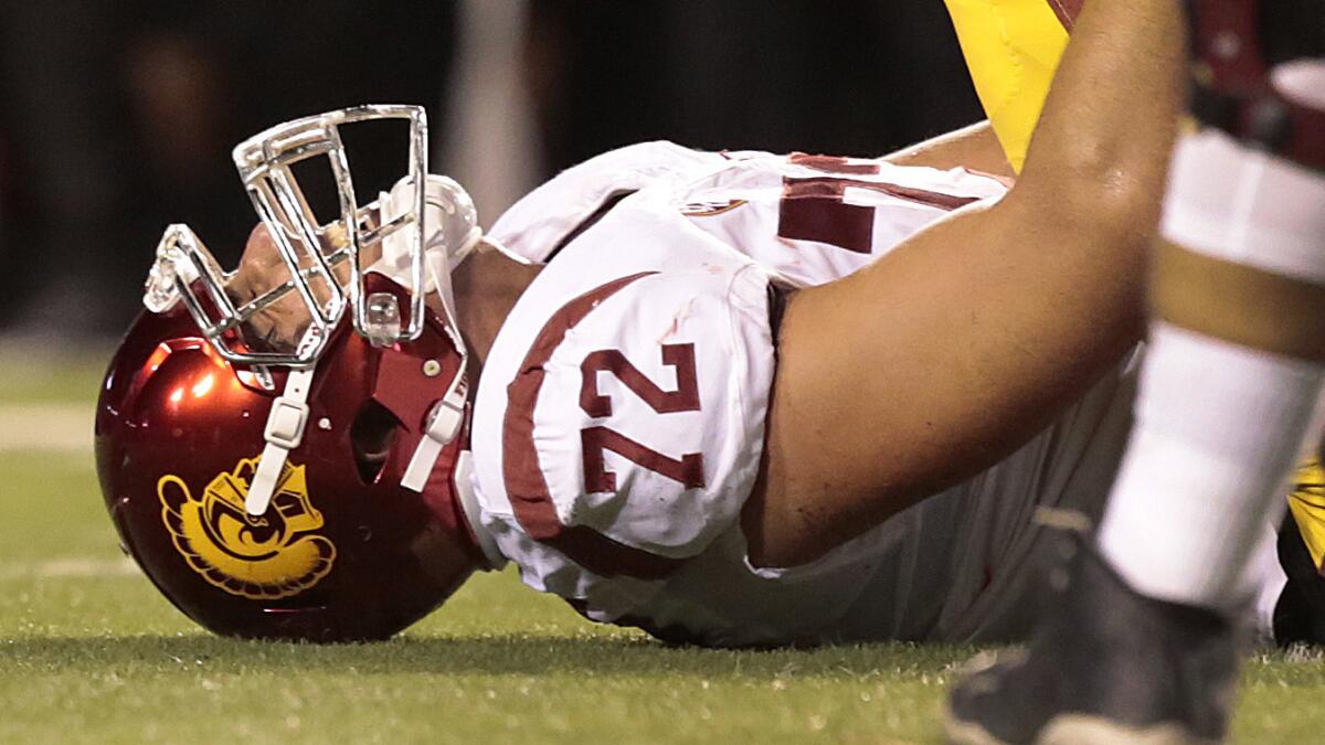 USC offensive tackle Chad Wheeler suffers a knee injury during a game against Utah on Oct. 25, 2014.