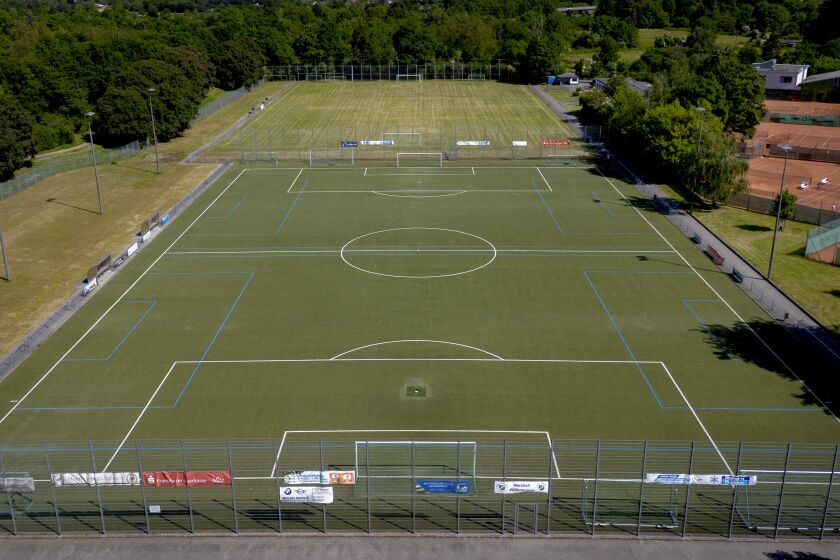 Pitches of a soccer club is pictured in Frankfurt, Germany, Tuesday, May 30, 2023. A 15-year-old soccer player remained hospitalized Tuesday with life-threatening brain injuries after being struck by an opposing player in a post-match fight during an international youth tournament in Germany. A 16-year-old from a French team was jailed pending further investigation by a judge in Frankfurt, where the match with a team from Berlin took place on Sunday. (AP Photo/Michael Probst)