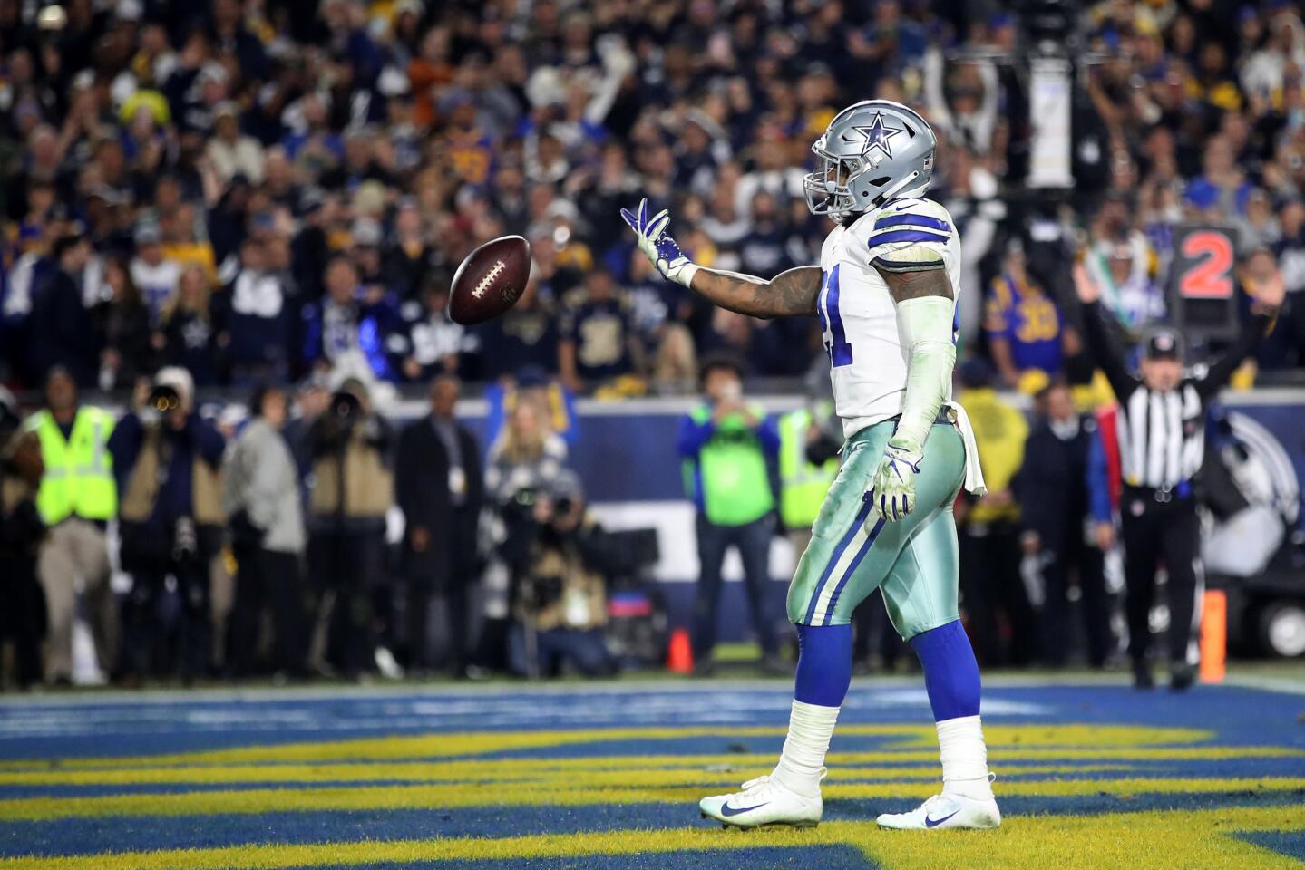 LOS ANGELES, CA - JANUARY 12: Ezekiel Elliott #21 of the Dallas Cowboys celebrates after scoring a 1 yard touchdown in the third quarter against the Los Angeles Rams in the NFC Divisional Playoff game at Los Angeles Memorial Coliseum on January 12, 2019 in Los Angeles, California. (Photo by Sean M. Haffey/Getty Images) ** OUTS - ELSENT, FPG, CM - OUTS * NM, PH, VA if sourced by CT, LA or MoD **