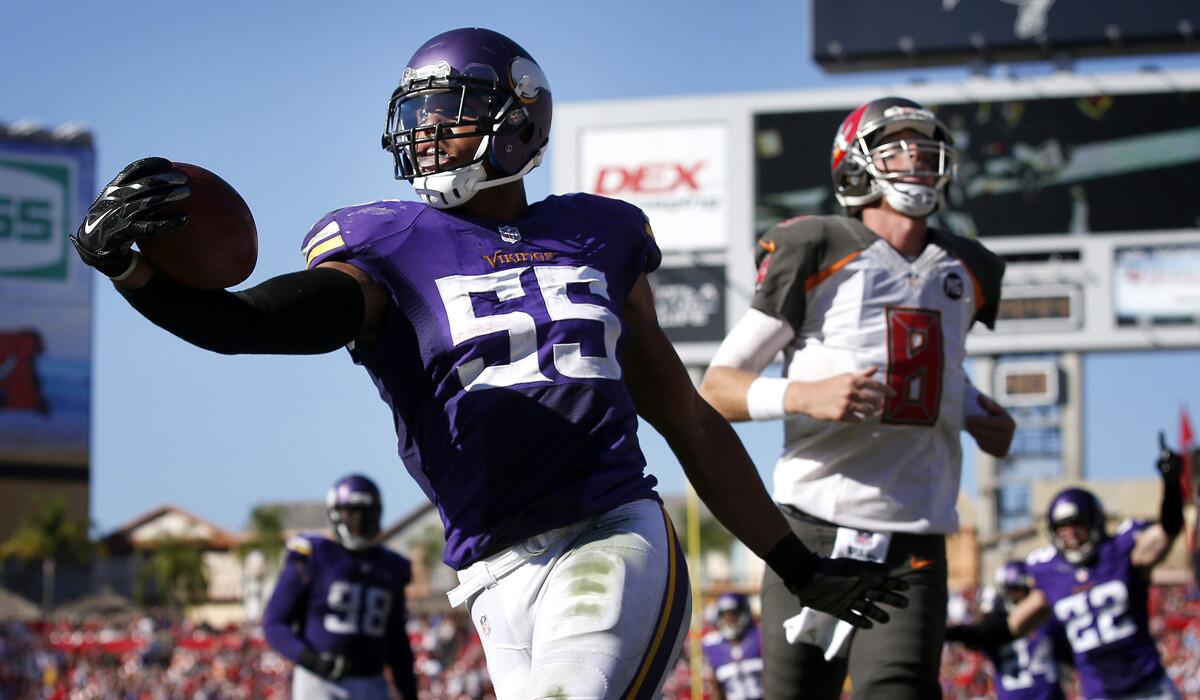 Vikings linebacker Anthony Barr finishes off a 27-yard return of a fumble to a touchdown against the Tampa Bay Buccaneers on Sunday.