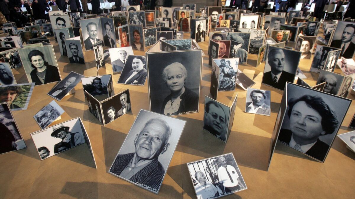 Pictures of French people who rescued Jews from the Nazis during World War II are displayed at the Pantheon in Paris on Jan. 18. 2007.