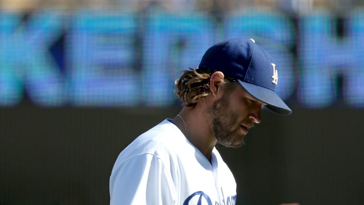 Dodgers ace Clayton Kershaw walks off the field after holding the Giants to one run over eight innings during a game Sept. 24.