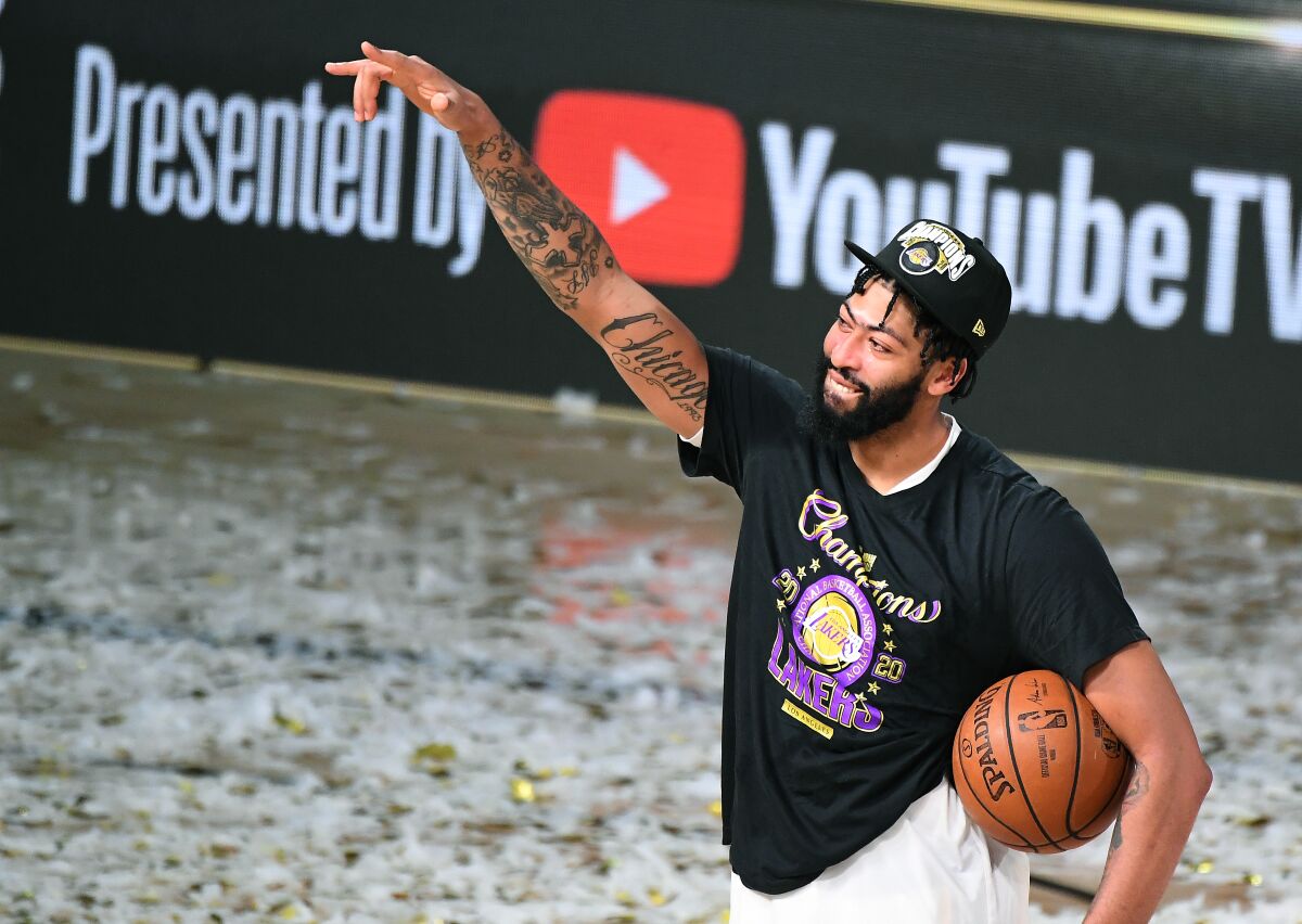 Lakers star Anthony Davis celebrates the NBA championship after winning Game 6 of the Finals on Oct. 11, 2020.