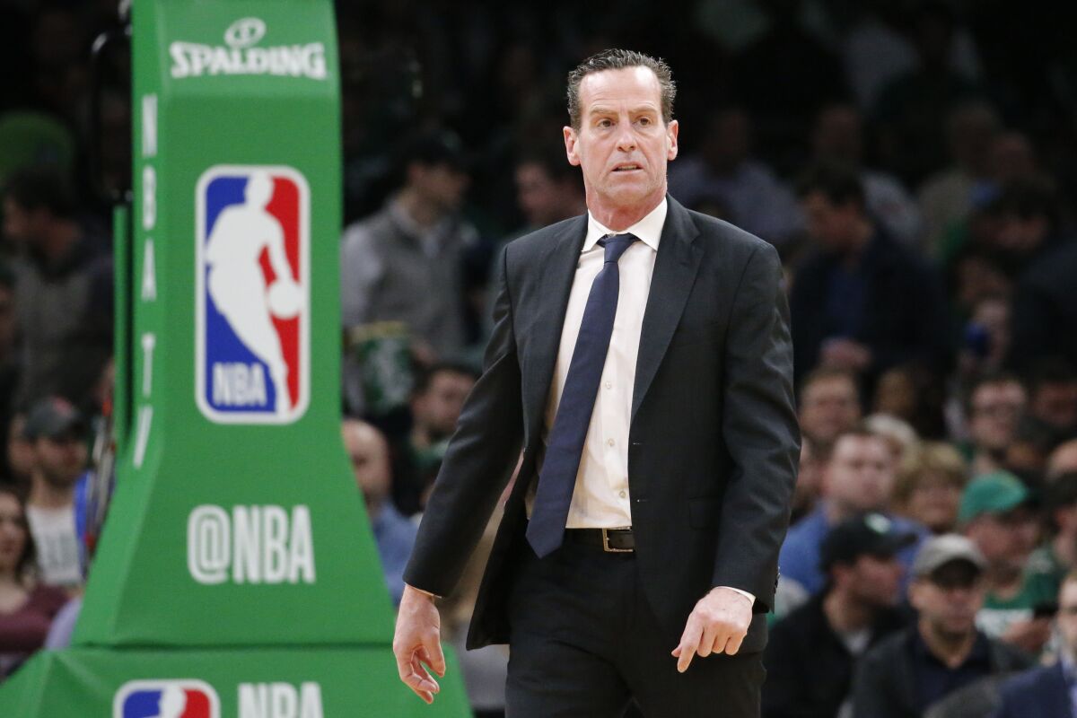 Former Brooklyn Nets coach Kenny Atkinson looks on during a timeout in the first half against the Boston Celtics.