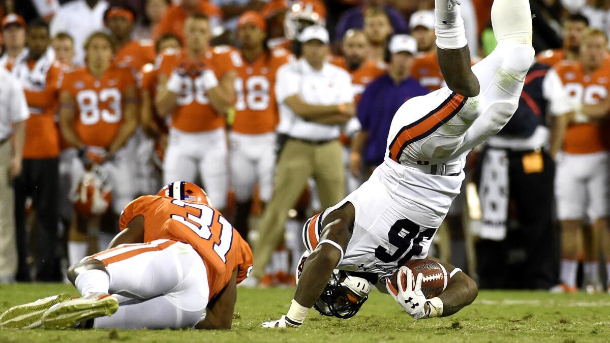 Auburn running back Kamryn Pettway (36) is upended by Clemson cornerback Ryan Carter (31) during the second half Saturday.