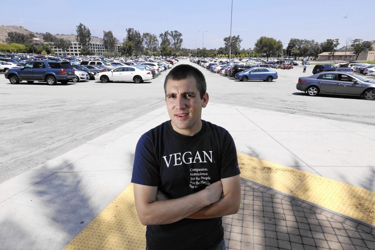 Nicolas Tomas, a Cal Poly Pomona nutrition major, was told by school administrators that he'd have to hand out leaflets on the vegan diet in a free speech zone.