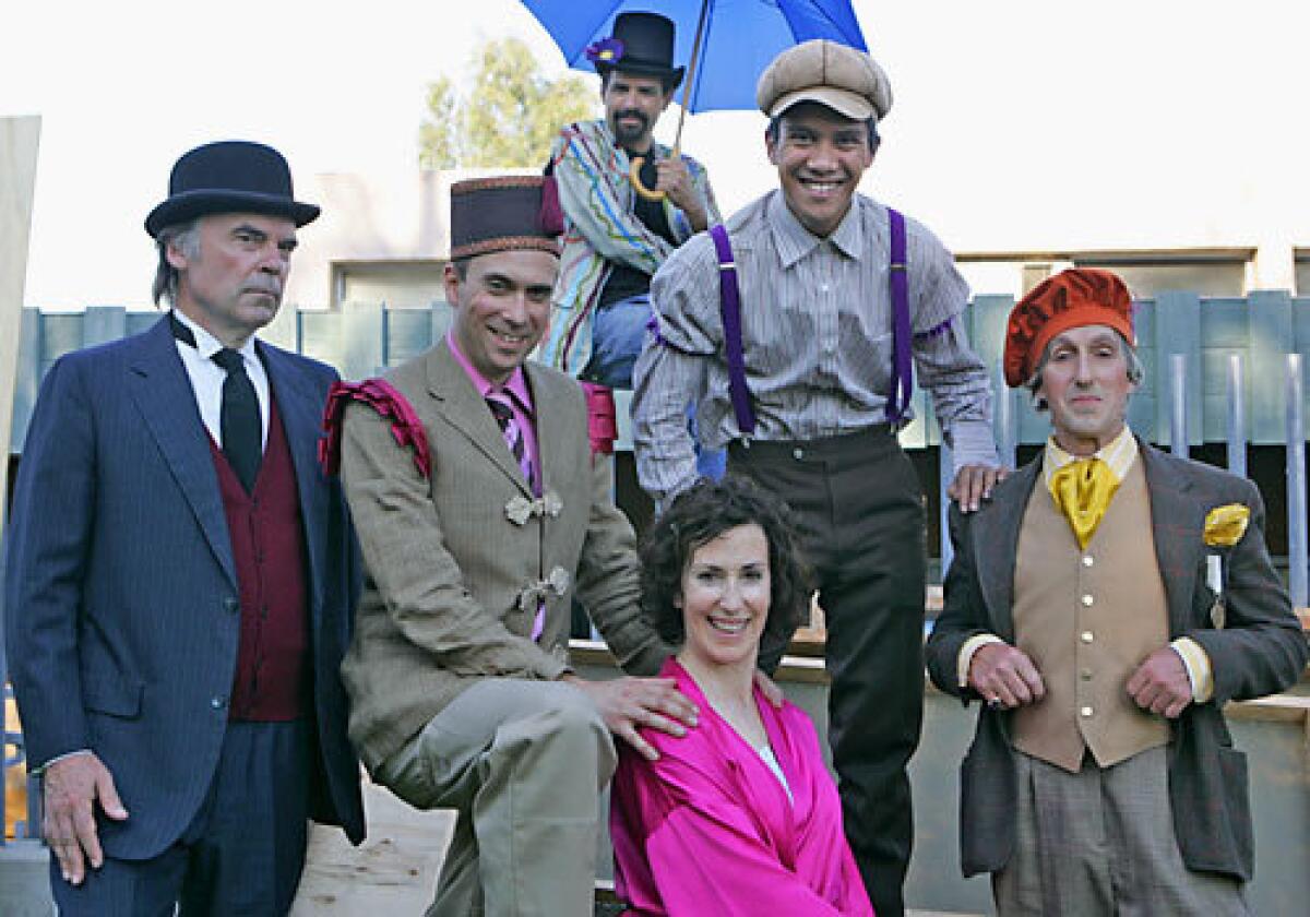The cast of the Independent Shakespeare Company --from left, Joseph Culliton, David Melville, Bobby Plasencia (with umbrella), Bernadette Sullivan, Edwin Tuazon and Thomas Ehas--at Barnsdall Park before a rehearsal for Twelfth Night in Hollywood.