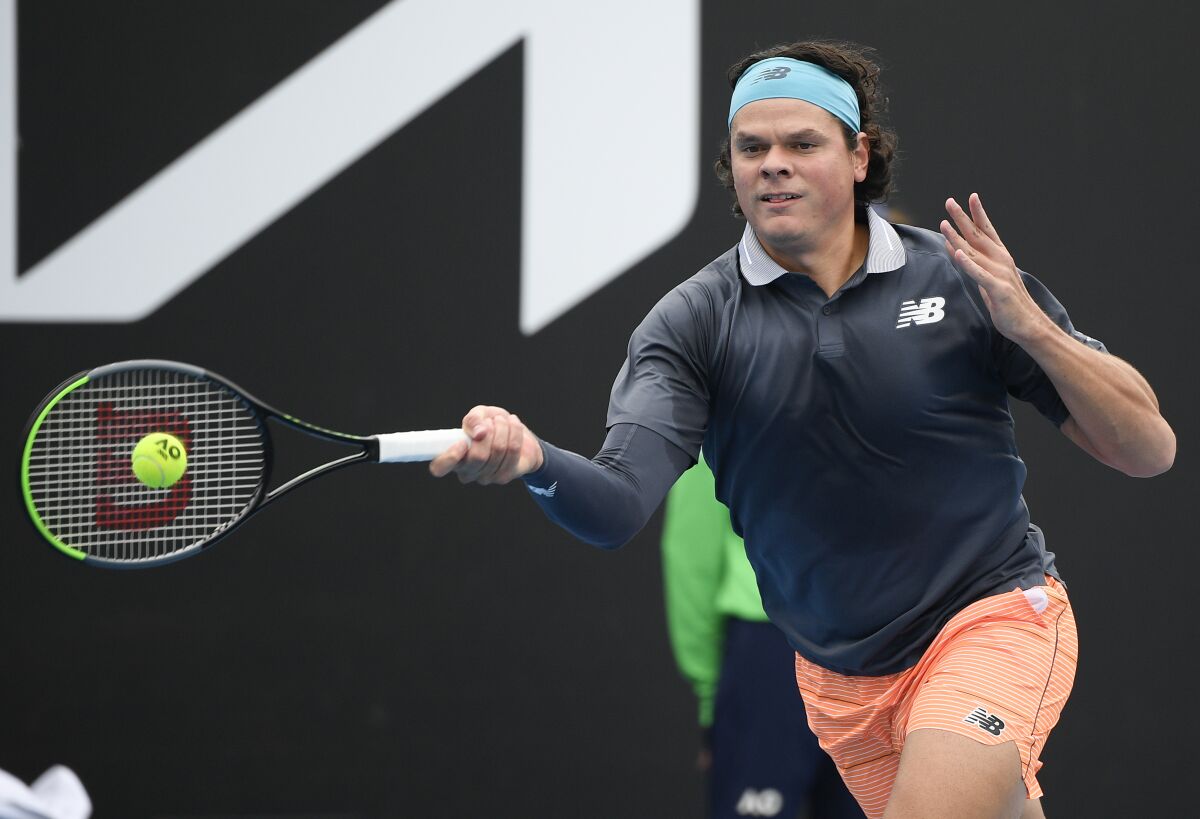 Milos Raonic makes a forehand return to Frederico Coria during his opening-round win at the Australian Open on Monday.