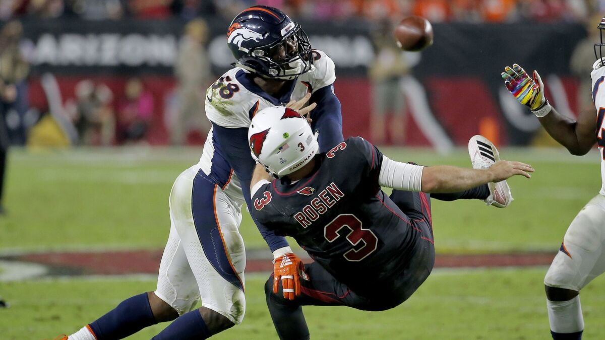 Denver Broncos linebacker Von Miller (58) hits Arizona Cardinals quarterback Josh Rosen (3) as he throws during the second half.