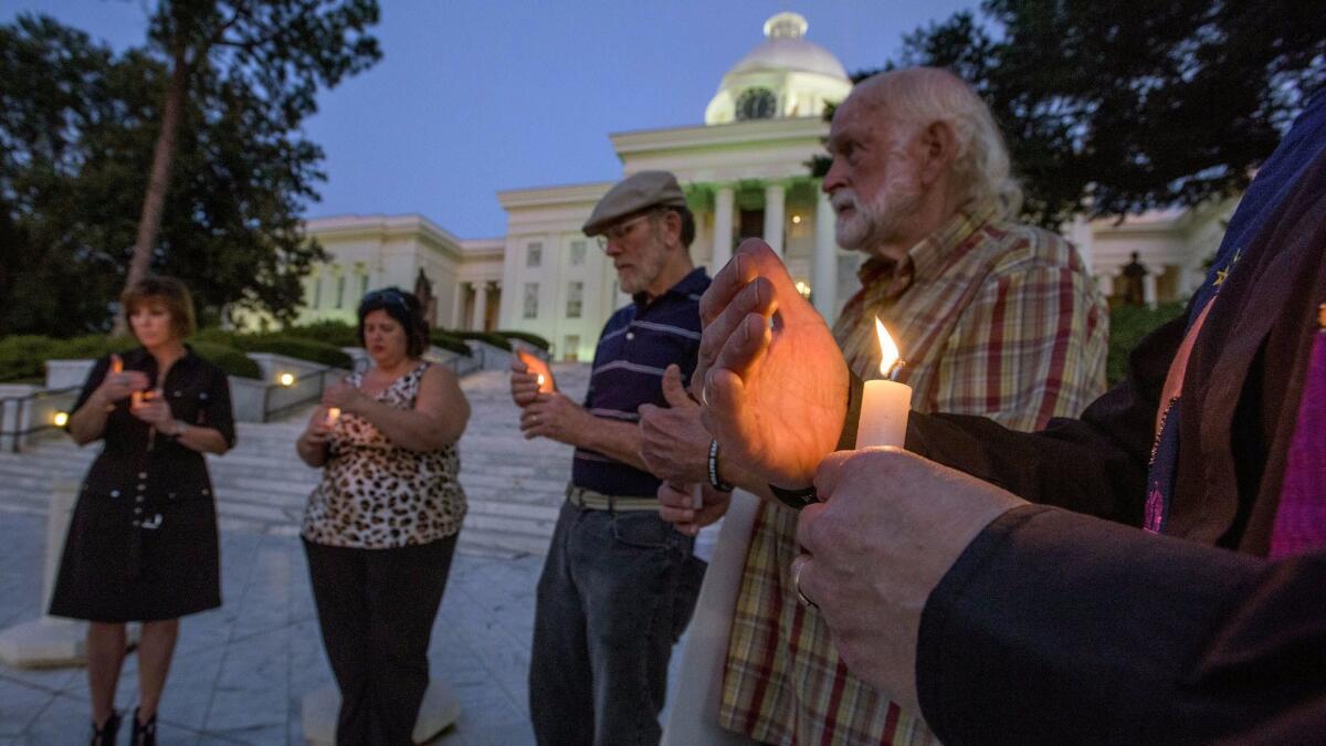 Concerned citizens gather for a candlelight vigil for a convicted murderer on the steps of the Alabama Capitol Building in Montgomery, Ala., on Nov. 3.