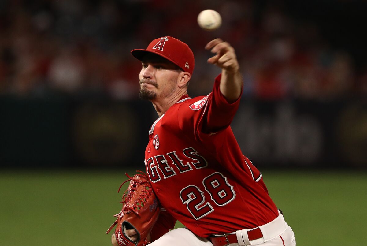 Angels pitcher Andrew Heaney delivers during the first inning of an 11-4 loss to the Tampa Bay Rays on Friday.