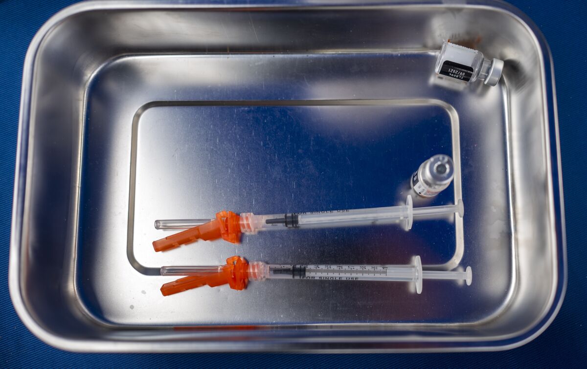 Syringes with COVID-19 vaccine