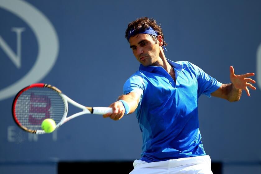 Roger Federer returns a shot during his first-round victory over Grega Zemlja at the U.S. Open on Tuesday.