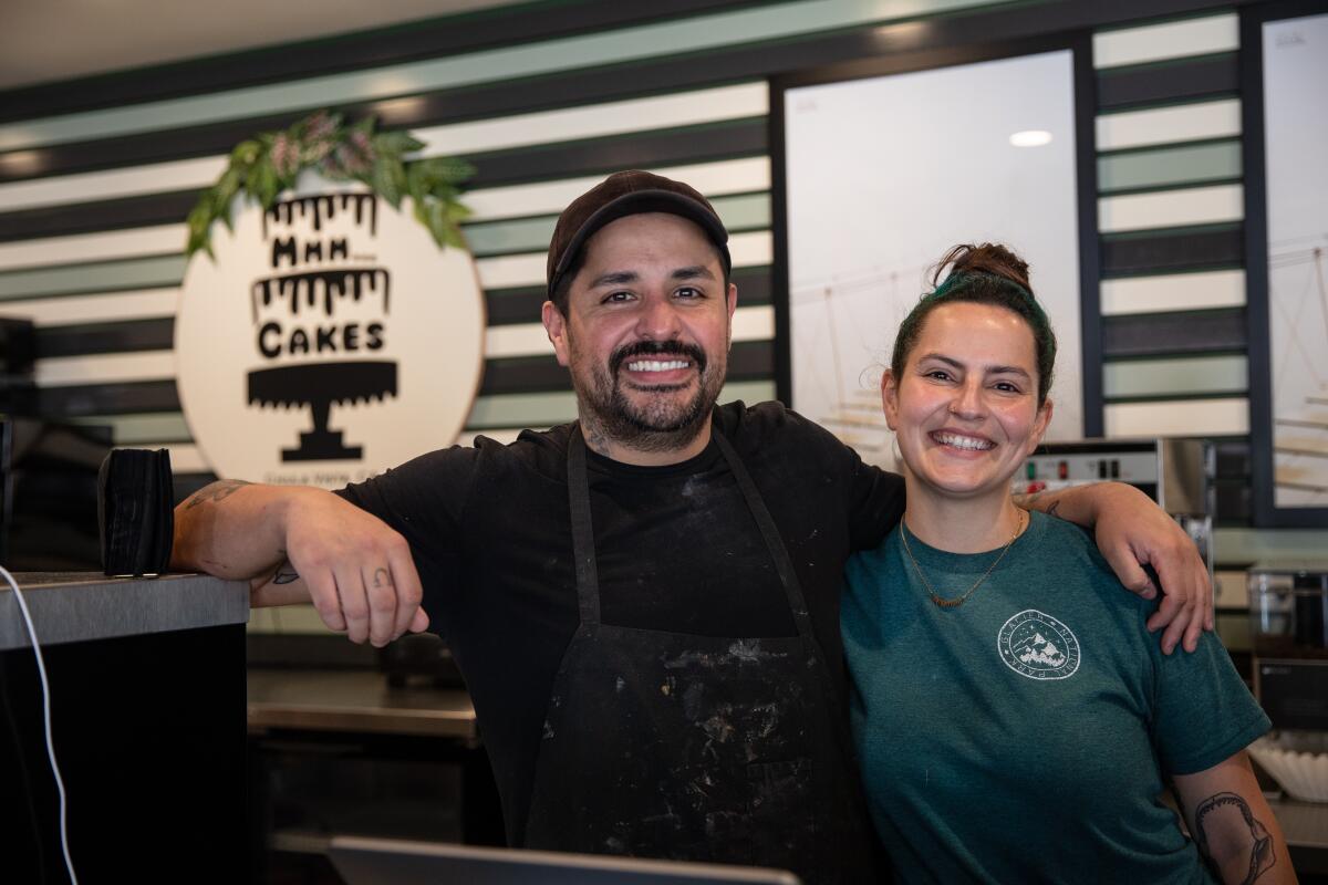 Co-owners Jose Barajas and Stevie Bowlin pose for a photograph at their bakery, Mmm… Cakes, on Thursday.