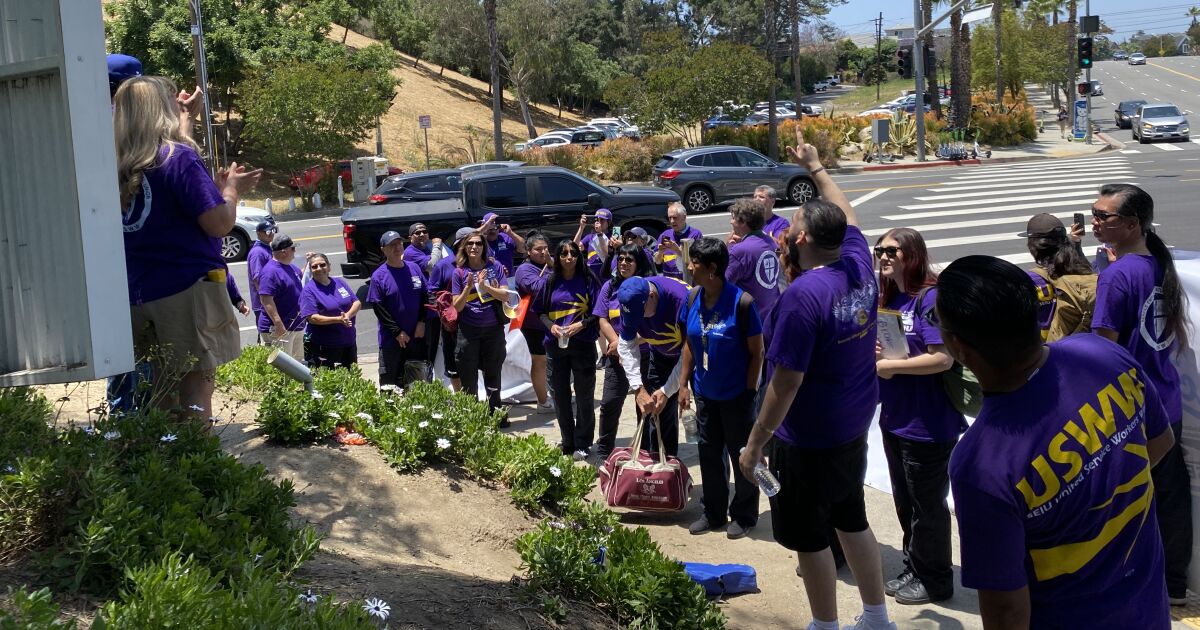 Dodger Stadium game-day workers protest, threaten to go on strike