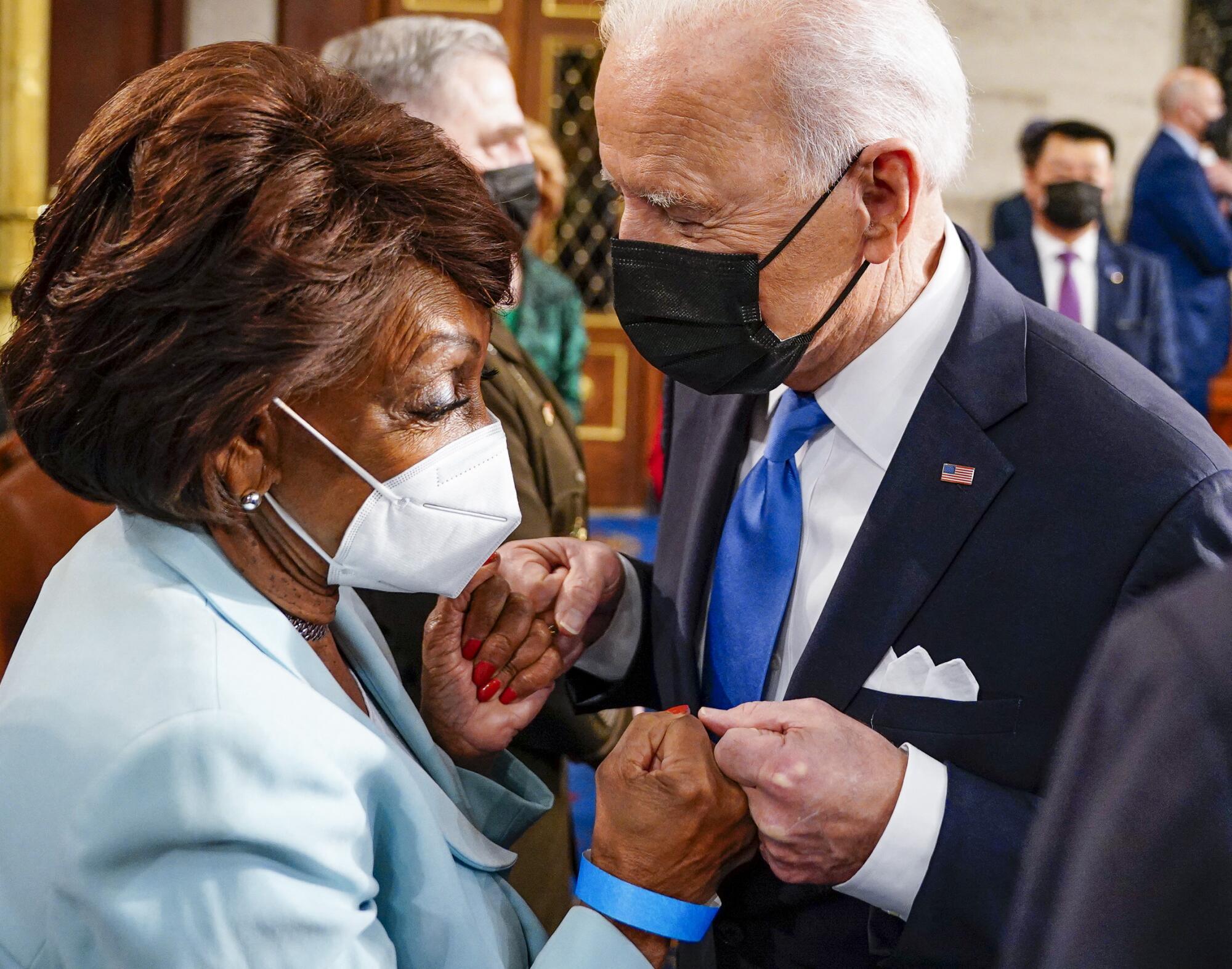 President Joe Biden fist bumps US Representative Maxine Waters (D-Calif.) after he concluded his address.