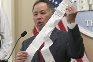 Assemblyman Phil Ting, D-San Francisco, displays a long paper receipt as he discusses his bill to require businesses to offer electronic receipts, Tuesday, Jan. 8, 2019, in Sacramento, Calif. Under the legislation customers could receive a paper receipt on request. (AP Photo/Rich Pedroncelli)