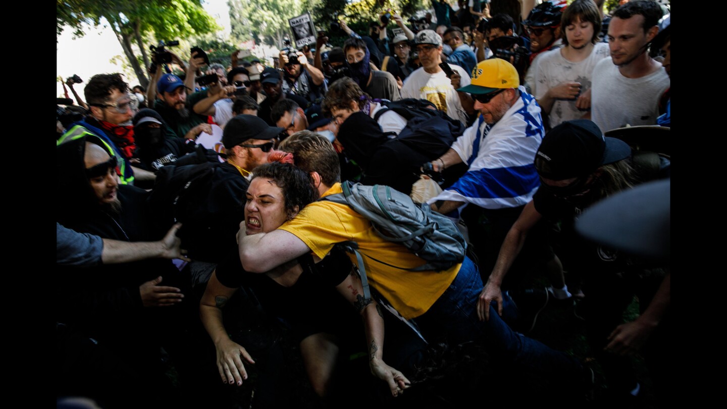Demonstrators clash as they beat up a man and chase him down during counter protest against white supremacist.