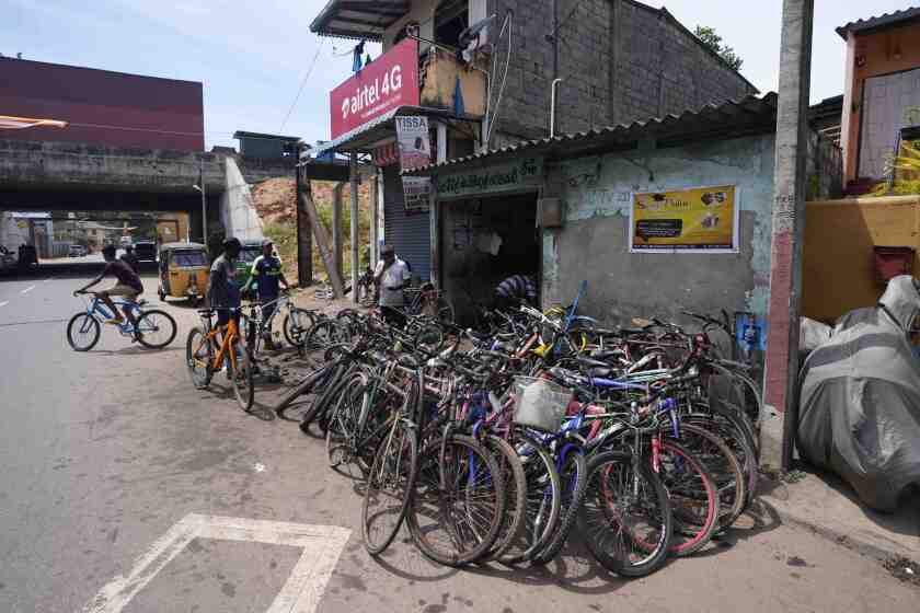 Bicycles given to be repaired are seen outside a workshop amid fuel shortage in Colombo, Sri Lanka, Tuesday, July 5, 2022. Sri Lanka's ongoing negotiations with the International Monetary Fund have been complex and difficult than the instances before because it has entered talks as a bankrupt nation, the country's prime minister said Tuesday. (AP Photo/Eranga Jayawardena)