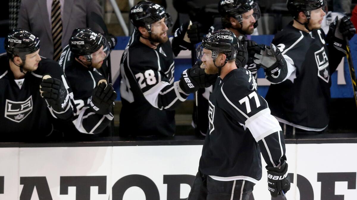 Kings forward Jeff Carter celebrates with his teammates after scoring during the second period of the Kings' 4-3 win over the Chicago Blackhawks in Game 3 of the Western Conference finals Saturday.