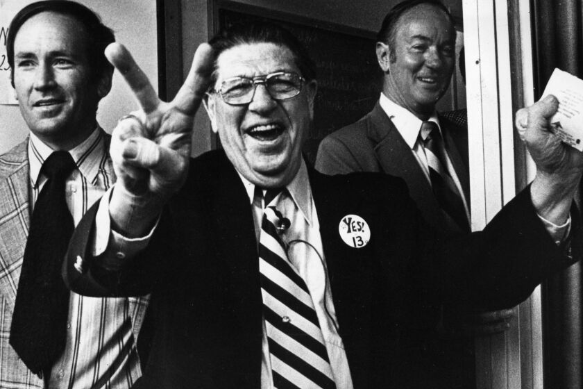 Howard Jarvis, chief sponsor of the controversial Proposition 13, signals victory as he casts his own vote at the Fairfax-Melrose precinct. June 6, 1978 photo by Ben Olender/Los Angeles Times. For From The Archives.