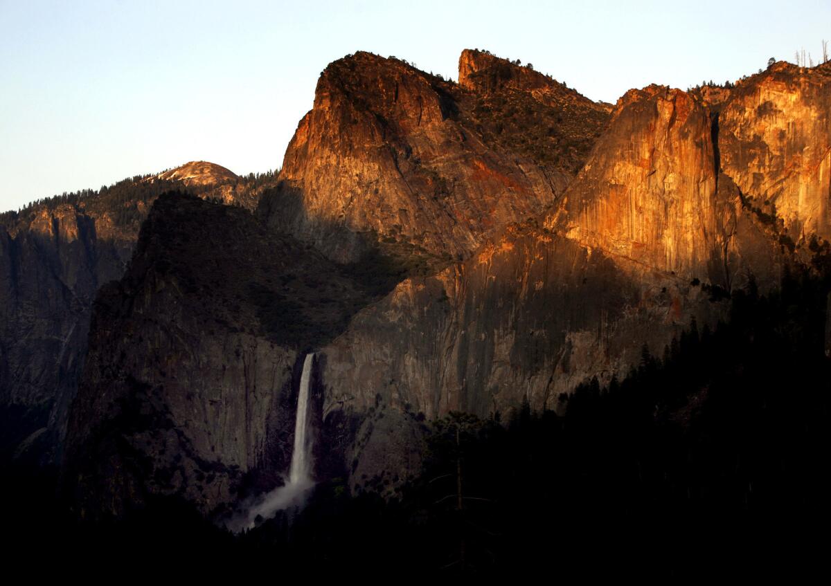 Bridalveil Fall and Cathedral Rocks in Yosemite National Park. A mountain climber was rescued Sunday, after he fell 30 feet while climbing nearby Higher Cathedral Spire.