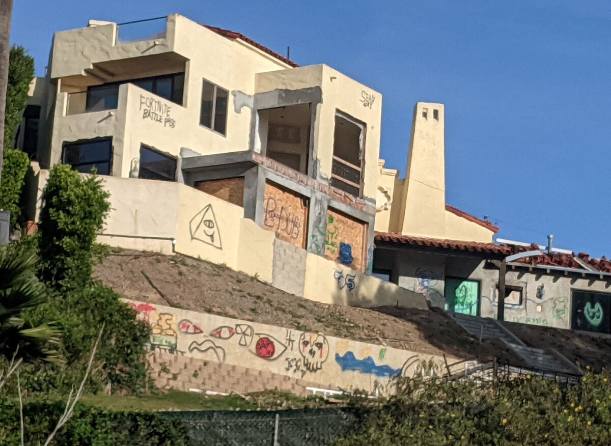 The back of this unoccupied Bird Rock house was heavily vandalized with graffiti, according to area resident Scott Rose.