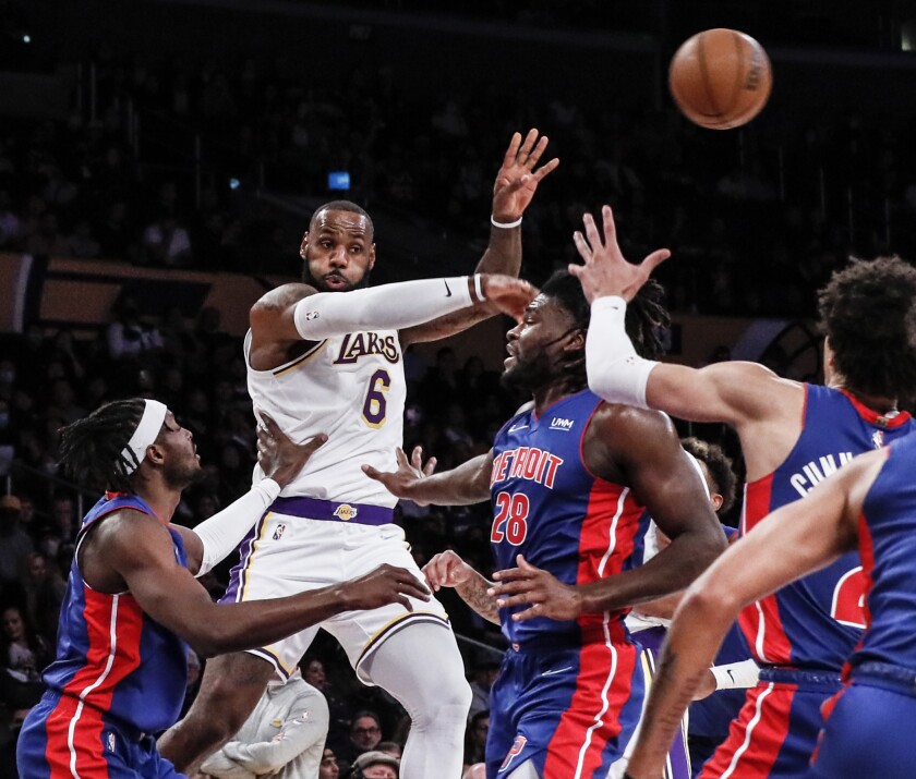 Lakers forward LeBron James passes the ball over Detroit Pistons center Isaiah Stewart (28) in the first half.