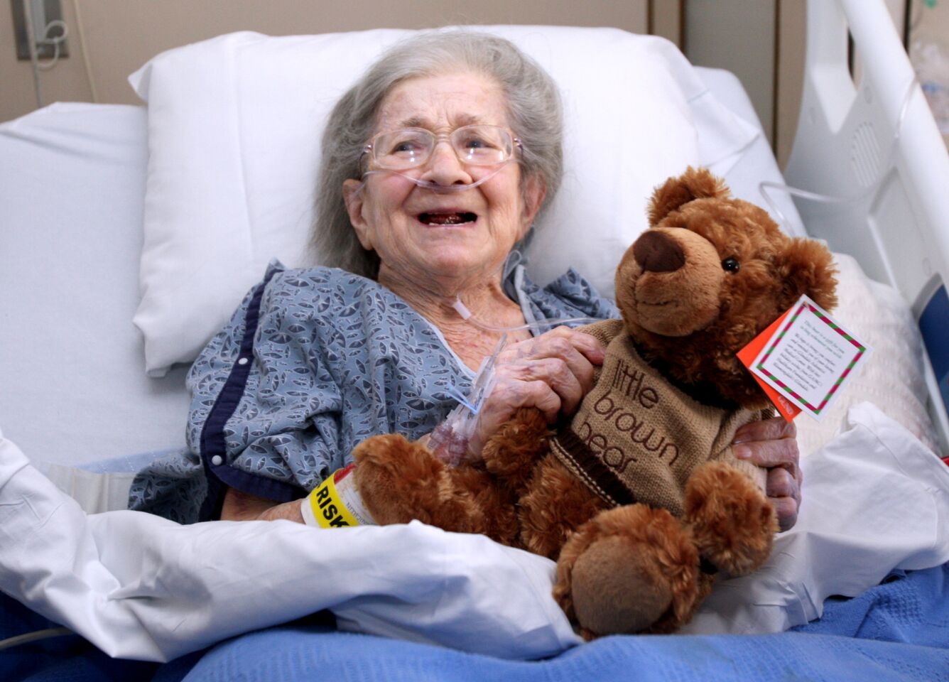 Glendale Adventist Medical Center staff presented patient Janet Jones with a teddy bear for the holidays, at GAMC in Glendale on Wednesday, December 23, 2015. Jones jokingly said she has a cat as big as this teddy bear. Sixty stuffed bears were handed out to patients throughout the hospital. A donor gave 30 bears and Bloomingdale's match the gift with another 30 bears.