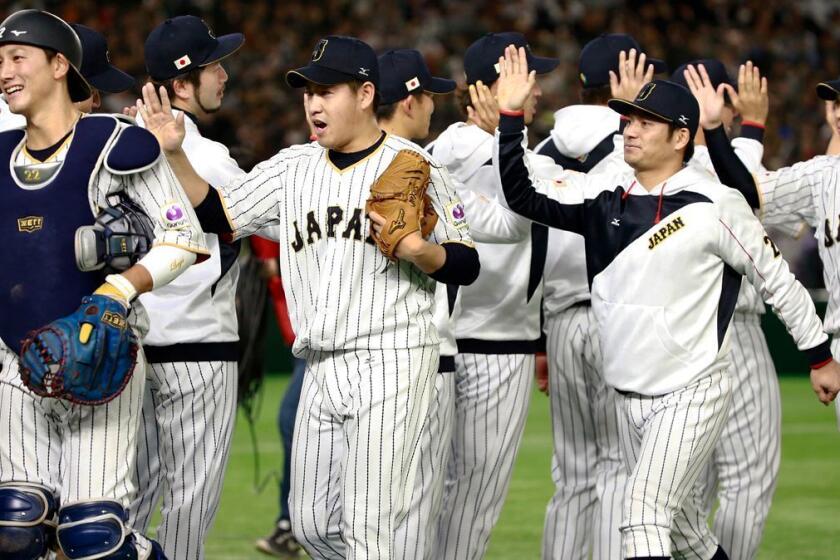 Japanese players, celebrating after beating Israel in a WBC second-round game March 15 at Tokyo, bring a sense of urgency to the tournament's semifinals in Los Angeles.