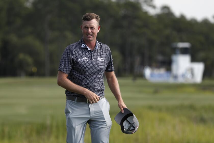 Webb Simpson walks off the 18th green after finishing his third round during the RBC Heritage golf tournament, Saturday, June 20, 2020, in Hilton Head Island, S.C. (AP Photo/Gerry Broome)