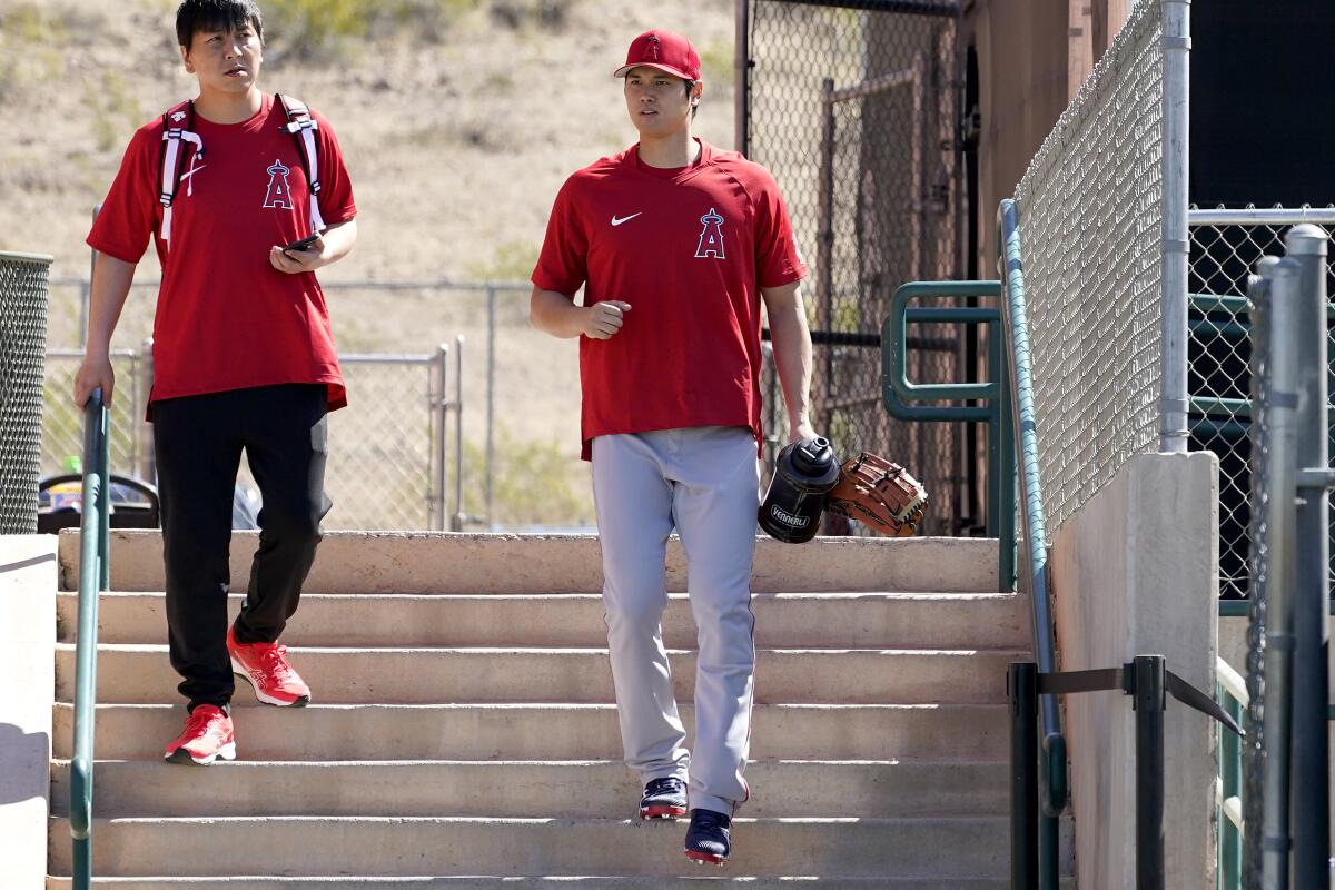 Angels' Shohei Ohtani arrives for the teams' spring training workouts.
