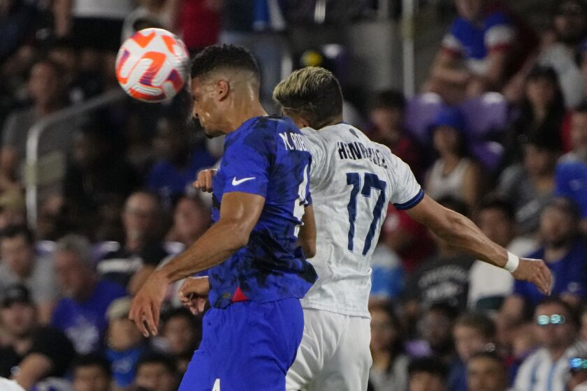 United States defender Miles Robinson (4) gets position on a head ball next to El Salvador forward Jairo Henriquez (17) during the first half of a CONCACAF Nations League soccer match Monday, March 27, 2023, in Orlando, Fla. (AP Photo/John Raoux)