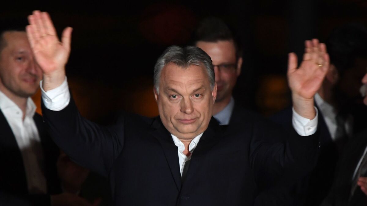 Hungarian Prime Minister Viktor Orban celebrates after winning the parliamentary election April 8.