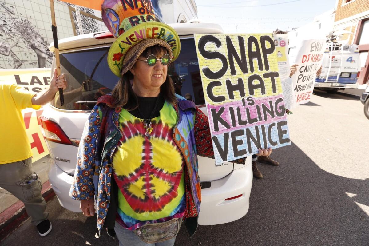 Vivianne Robinson protests near Snap's offices.