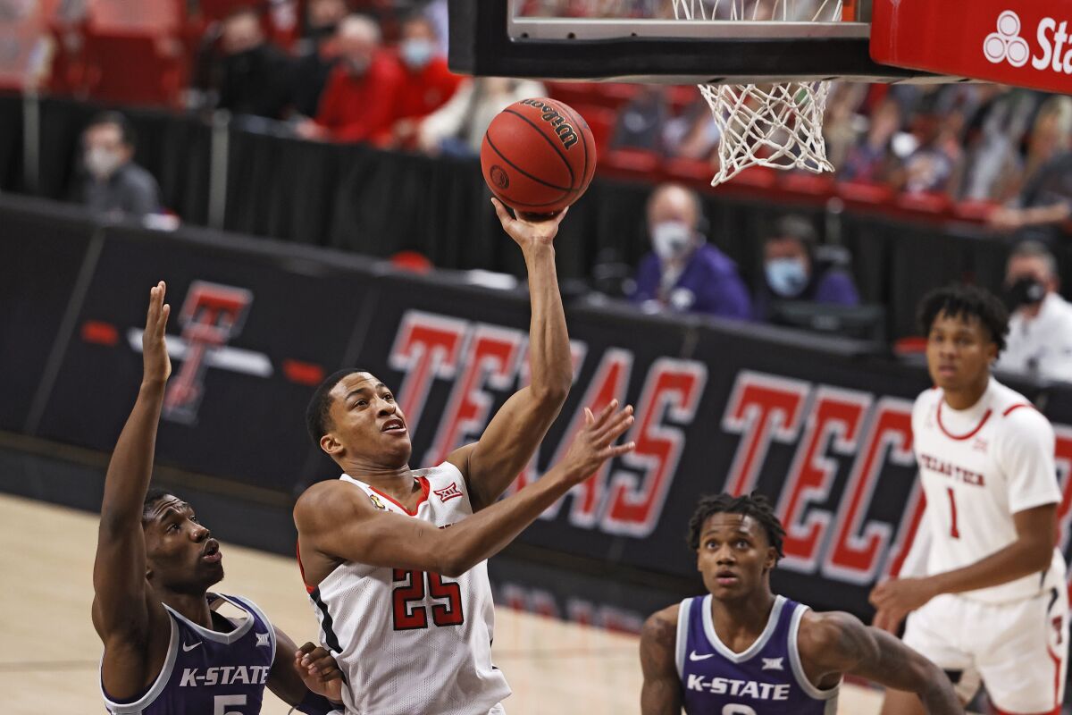 Texas Tech's Nimari Burnett (25) lays up the shot during the second half of an NCAA college basketball game against Kansas State, Tuesday, Jan. 5, 2021, in Lubbock, Texas. (AP Photo/Brad Tollefson)