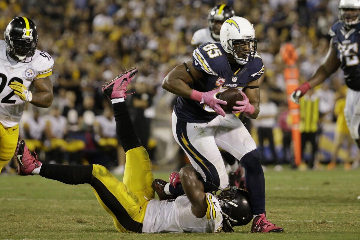 San Diego tight end Antonio Gates tries to break free from Pittsburgh linebacker Sean Spence on Oct. 12.
