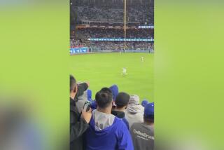 Marriage proposal in outfield at Dodger Stadium ends with a big hit
