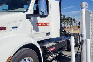 A commercial truck gets charged at Truck Net in Otay Mesa.