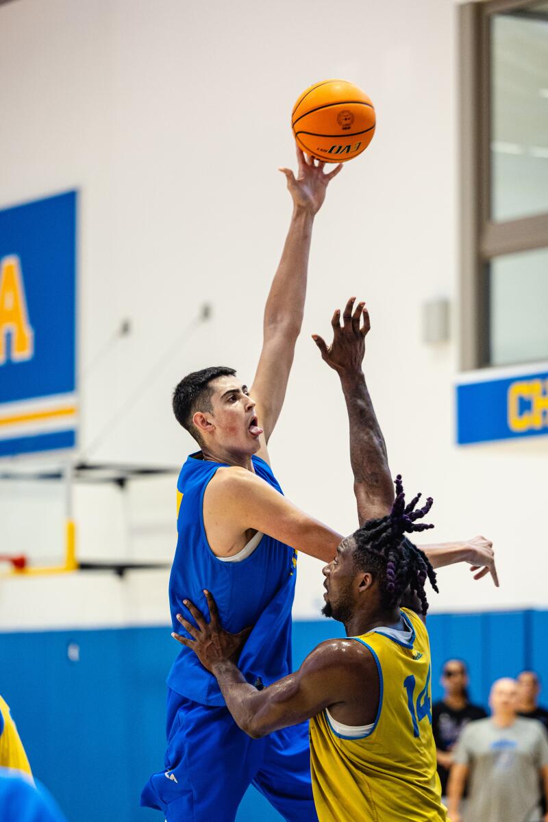 Aday Mara, a 7-foot-3 UCLA freshman, takes a shot during practice.