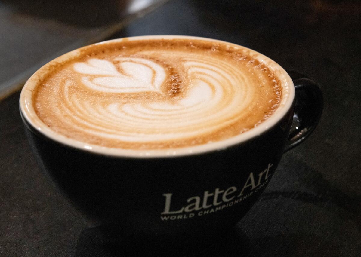 A poured latte sits on the counter at MoonGoat Coffee Roasters' new location.