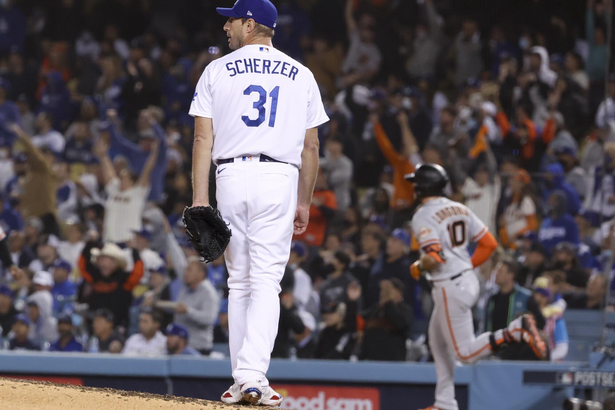  Dodgers starting pitcher Max Scherzer looks back after giving up home run.