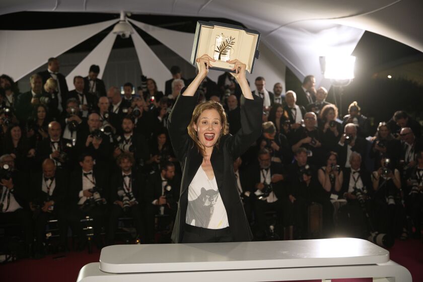 Justine Triet, winner of the Palme d'Or for 'Anatomy of a Fall,' poses for photographers during a photo call following the awards ceremony at the 76th international film festival, Cannes, southern France, Saturday, May 27, 2023. (AP Photo/Daniel Cole)