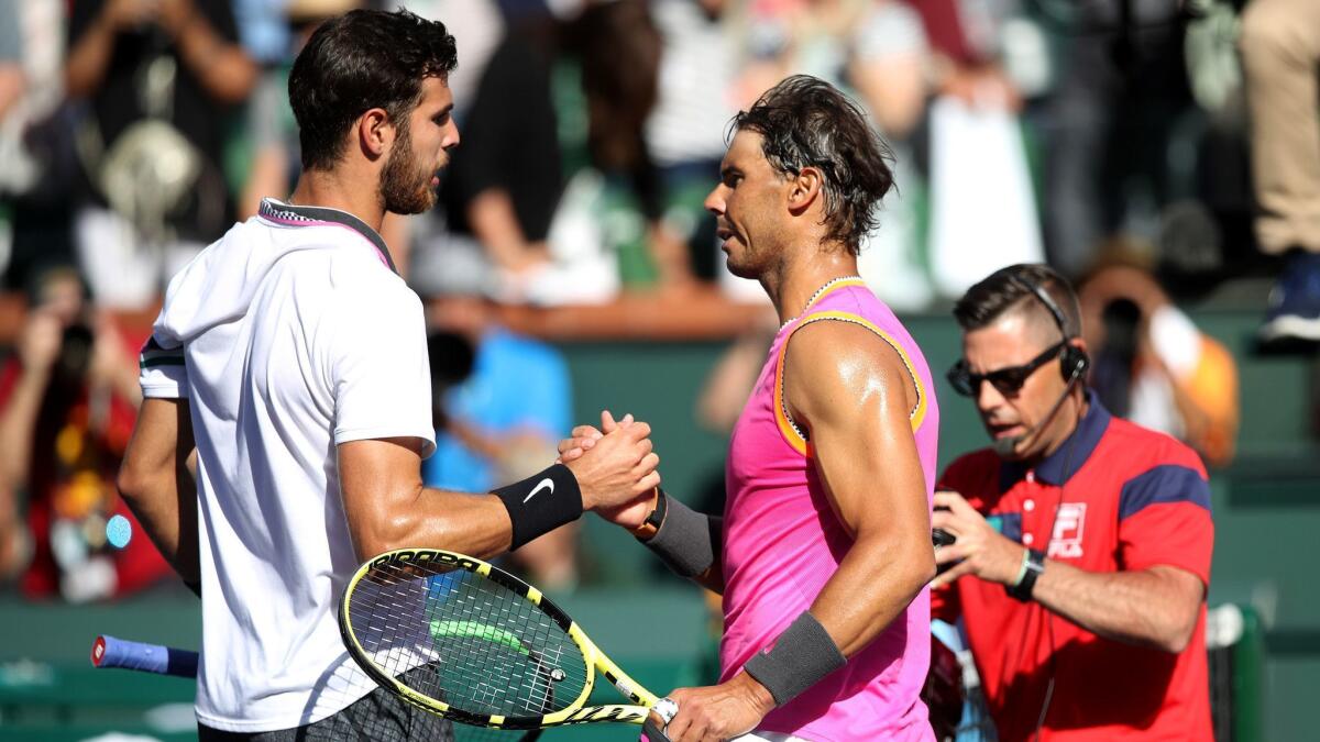Rafael Nadal shakes hands with Karen Khachanov after defeating him in straight sets in their quarterfinal match at the BNP Paribas Open in Indian Wells.