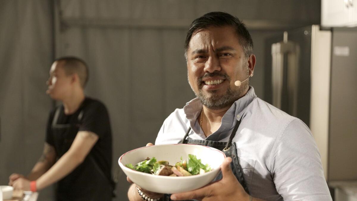 Chef Richard Zarante of Rosaline poses with his como saltado after performing a live demomstration on opening night.