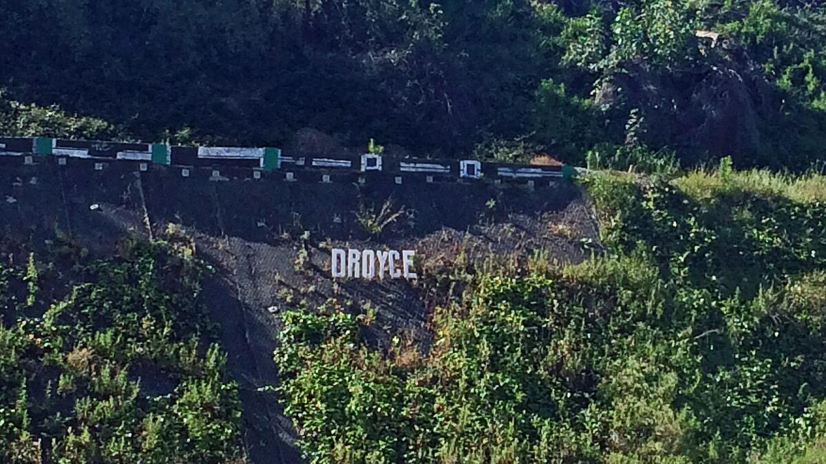 An installation by the graffiti artist Droyce is seen on the side of the 101 Freeway in Boyle Heights. (Carolina A. Miranda / Los Angeles Times)