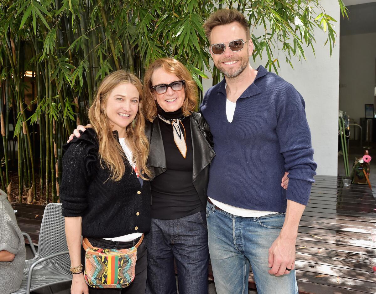 Event co-chair Sarah McHale, left, and her actor-comedian husband, Joel McHale, join Hammer Museum director Ann Philbin.