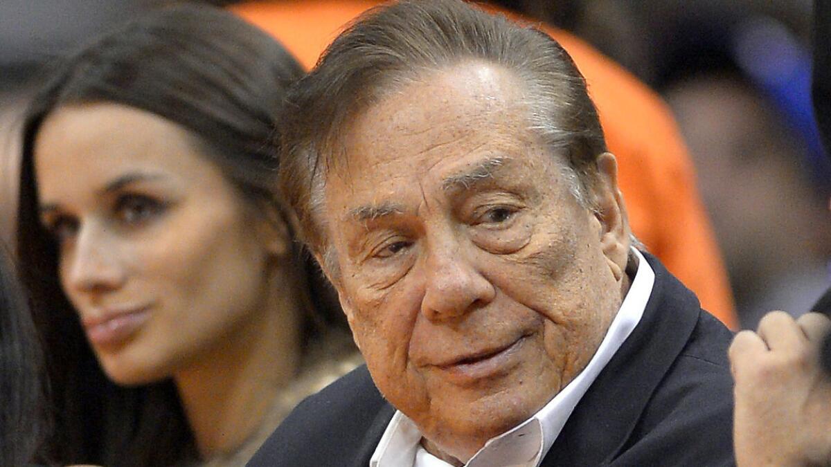 Clippers co-owner Donald Sterling looks on during a 2013 game between the Clippers and Sacramento Kings at Staples Center. A neurologist testified Monday that she concluded following an examination of Sterling that he suffered from Alzheimer's disease.
