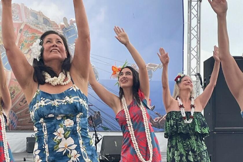 La Jolla High School student Aiko Busby (center) has been hula dancing since she was 5.