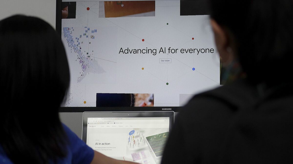 A Google employee gives a demonstration on artificial intelligence at the Google I/O conference in Mountain View, Calif., in May.